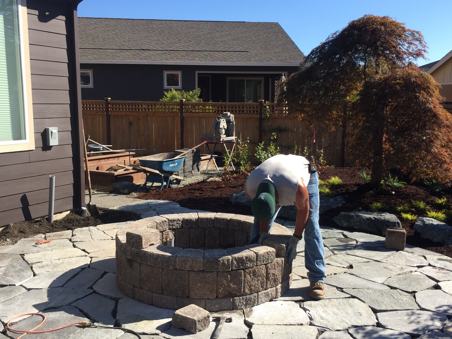Todd's landscape crew building fire pit and patio